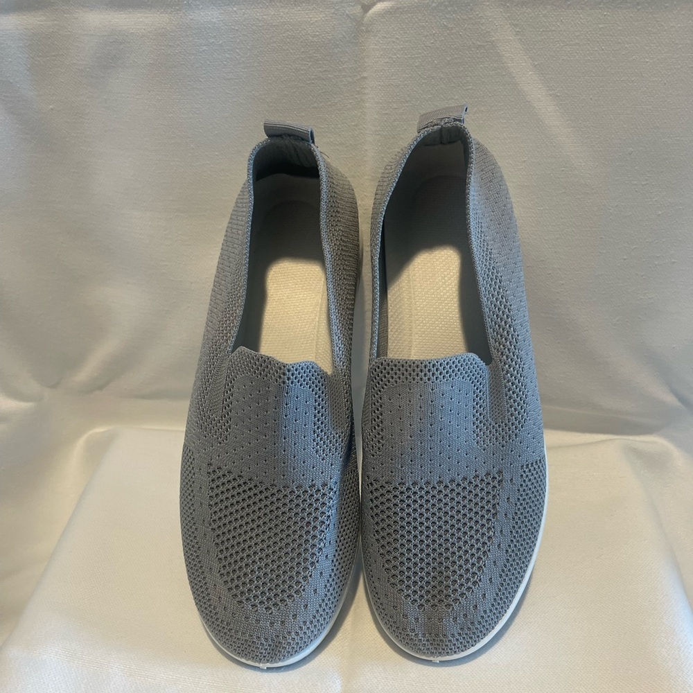 Gray mesh slip on sneaker.